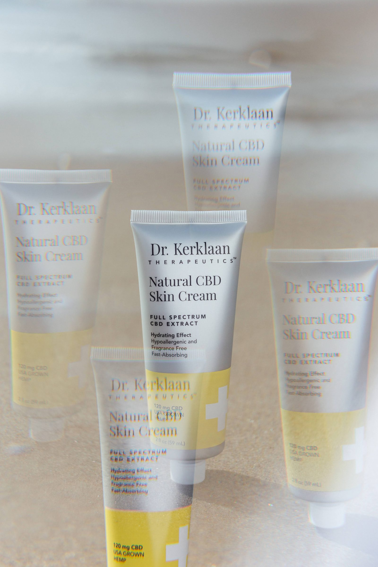 Dr. Kerklaan products laid on sand at the beach