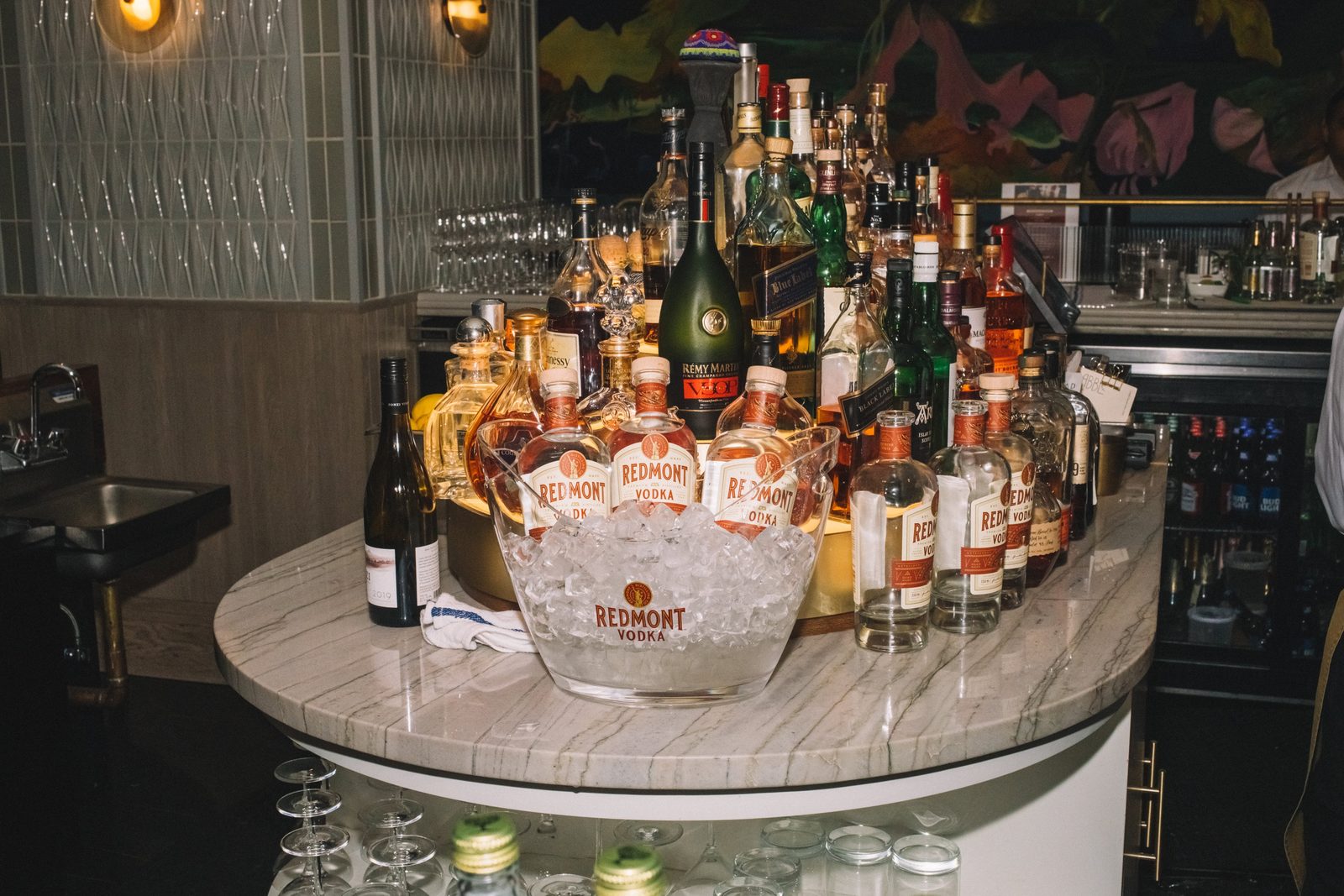 Redmont Vodka bottle display staged on the back bar