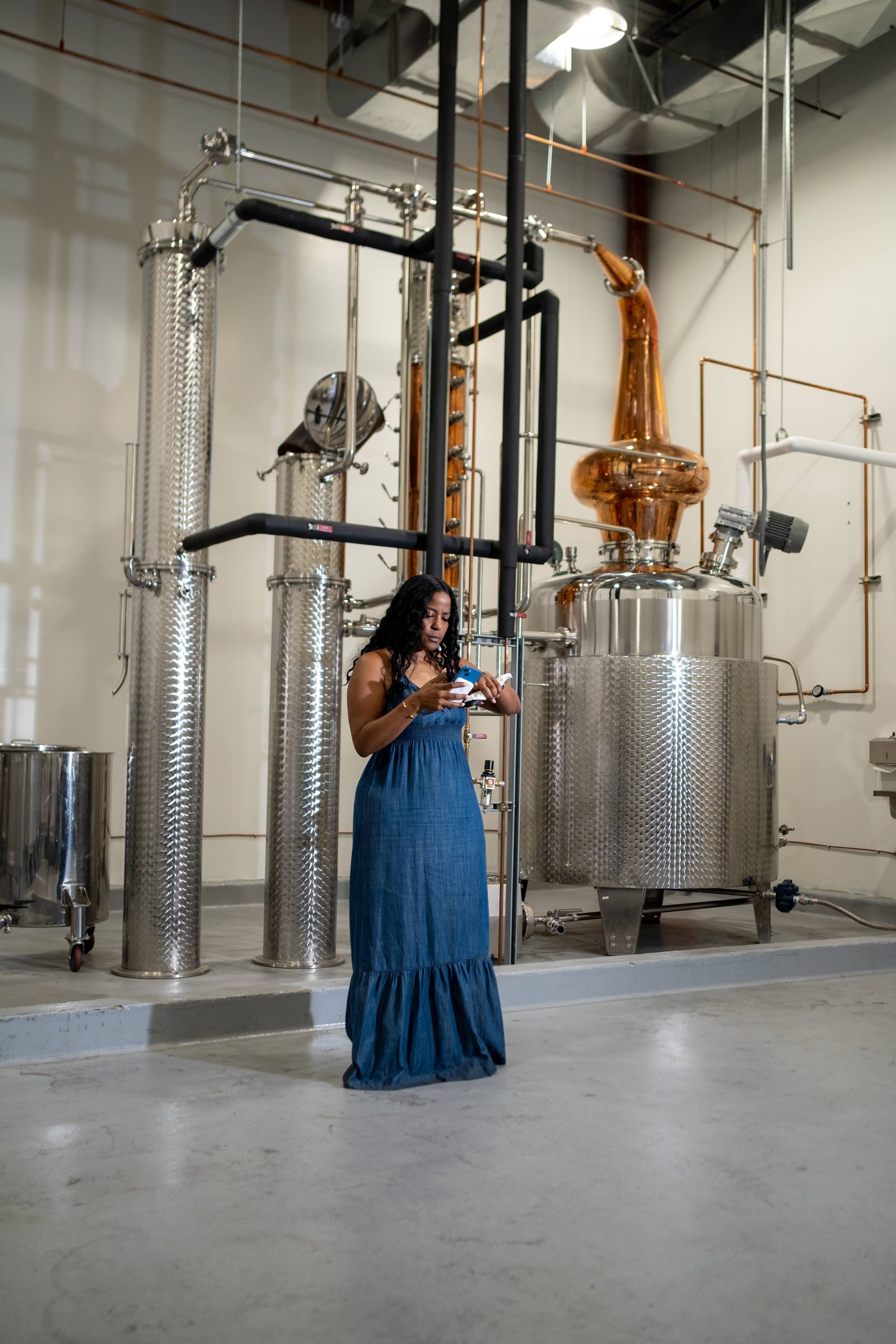 Distillery interior with copper stills at the host venue