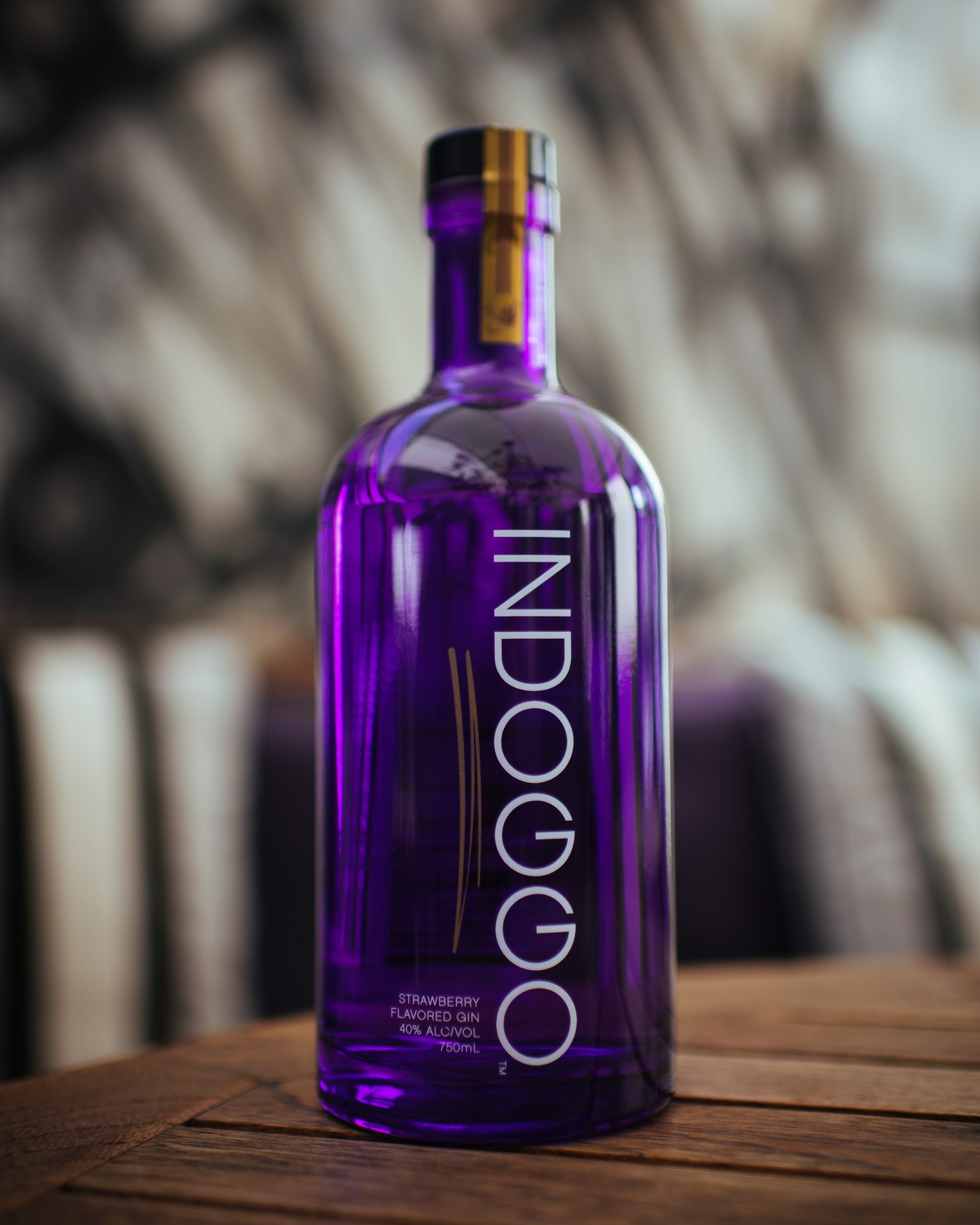 INDOGGO Gin bottle photographed on a wooden bar top