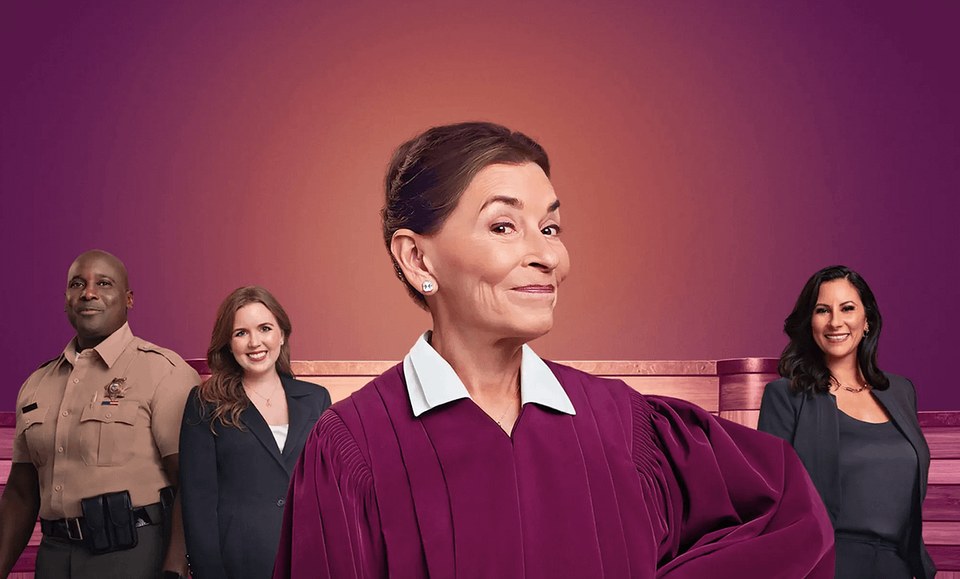 Judy Justice cast art, Judge Judy Sheindlin in the courtroom with the show's cast behind her