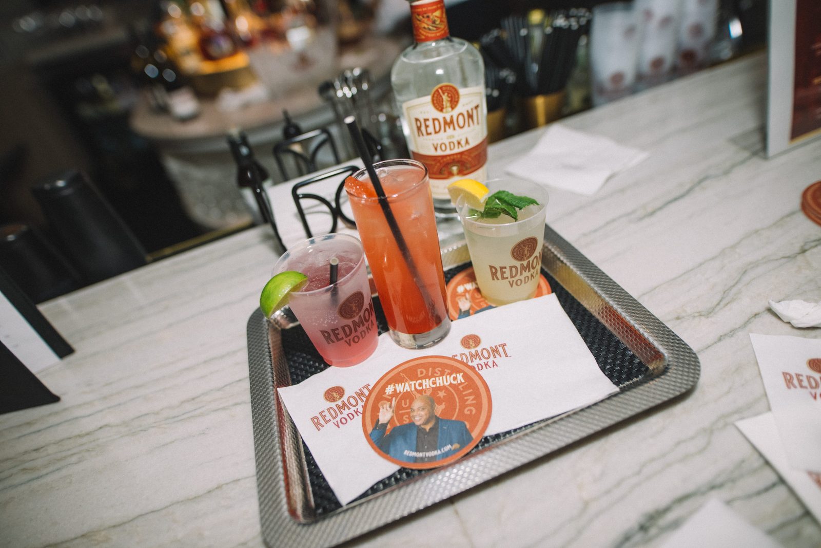 Redmont Vodka serves on a branded tray at the end of the bar