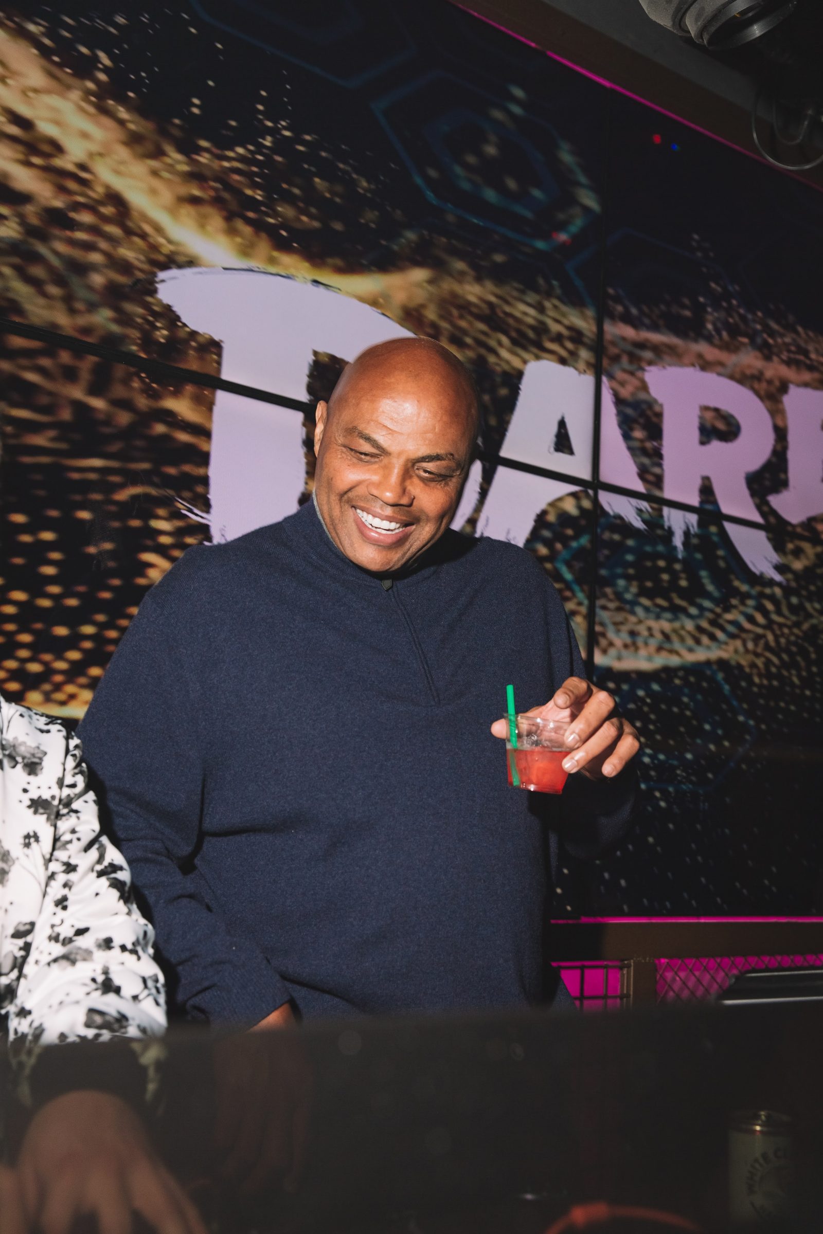 Charles Barkley in front of the screen wall during the activation