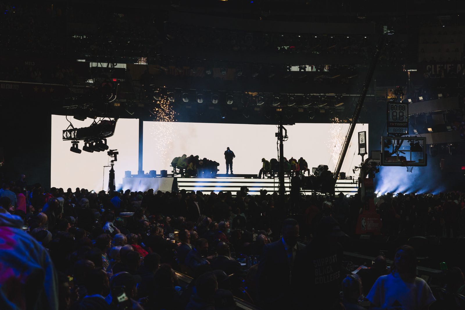 Main stage and production rig seen across the arena floor